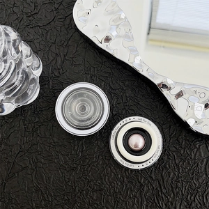 Detail of round phone sockets featuring elegant pink pearl inlay and Gift For You engraving
