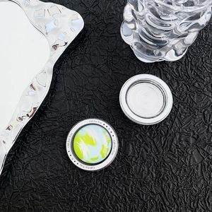 Close-up of glass magnetic phone grip with Earth pattern and Gift For You text