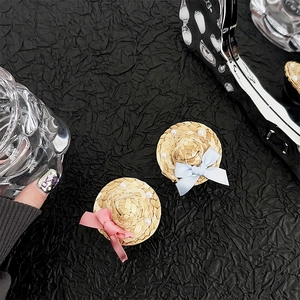 Miniature straw hats with pink and blue bows and pearls for phone socket grips