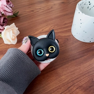 Close-up of cute black cat phone grip with heterochromia eyes and Gift For You base