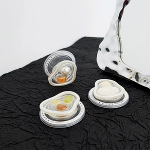 Macro view of gem heart phone grips with pearl texture and Gift For You engraving