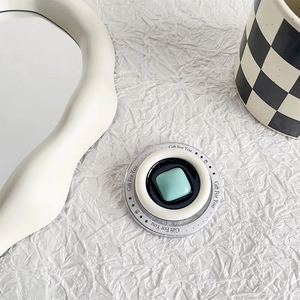Detail of mint green telescopic phone grip with pearl accent and Gift For You print