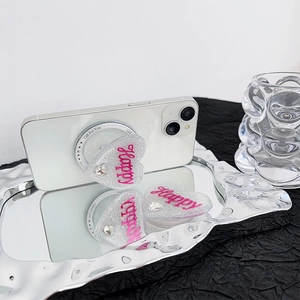 Glitter heart phone socket with pink Happy text and rhinestones on a mirror tray