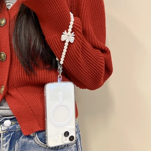 Transparent magnetic phone case with elegant pearl wrist strap and resin bow decoration