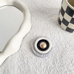 Detail of creative phone socket featuring Gift For You text and golden dome design