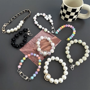 Lanyard phone chains with pearls and colorful beads with elegant bow accents on grey background