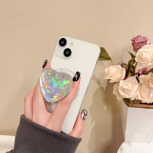 Close-up of heart-shaped holographic phone pop socket with Gift For You text engraving
