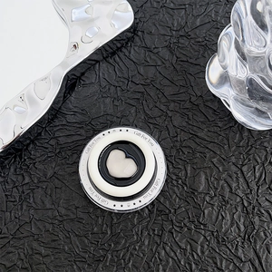 Close-up of magnetic Magsafe phone grip featuring heart design and 'Gift For You' text
