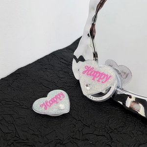 Sparkling pink heart-shaped collapsible phone grip with Happy print and rhinestone inlay