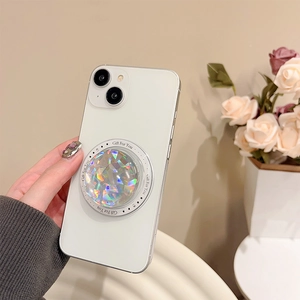 Close-up of holographic heart phone grip with laser cut surface on a clear phone case