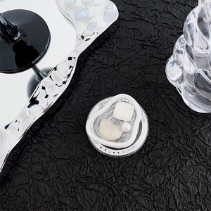 Macro view of heart-shaped gem phone grip with pearl detail and Gift For You text