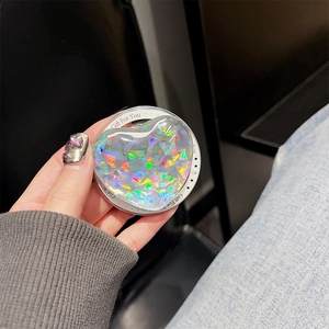Macro shot of a laser holographic heart phone socket with Gift For You printed text