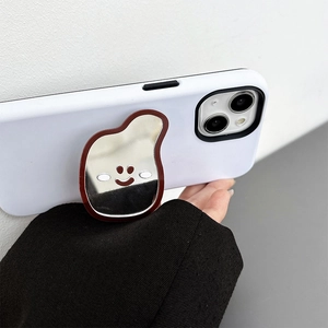 Detail of white matte phone case with irregular smiley face mirror expanding socket
