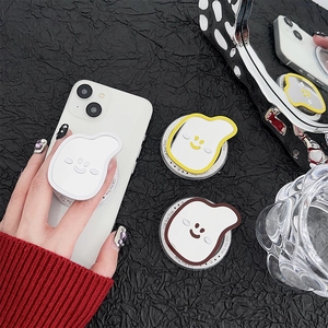Cute banana mirror phone grip with cartoon smiley face on stylish black texture