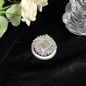 Detailed macro view of luxury rhinestone magnetic phone grip with sparkling crystals