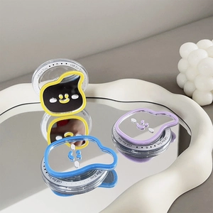 Detailed view of colorful banana-shaped portable mirrors on a white wave tray