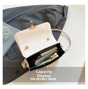 Internal view of cream square sequin bag showing storage space for phone and makeup