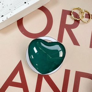 Dark green glitter heart phone grip with high gloss finish on minimalist background