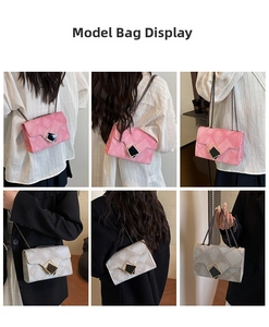 Detail view of pink and silver quilted chain crossbody bags worn by a fashion model