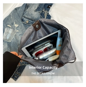 Top view of large capacity tote bag interior with tablet and daily essentials