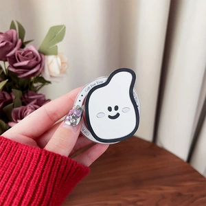 Close-up of cute banana mirror phone grip with Gift For You print and minimalist smile