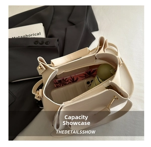Interior view showing the large capacity of the beige leather tote bag with inner pocket