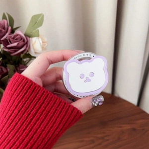 Detail of cute purple bear MagSafe phone grip with small mirror shown in hand