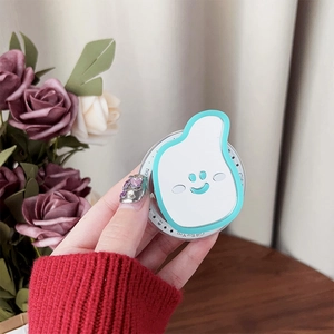 Close-up of cute cloud-shaped phone grip with smiling face held by hand on desk