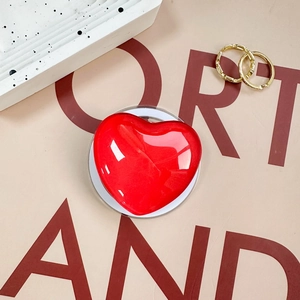 Glossy red heart-shaped magnetic phone grip holder with shiny translucent finish