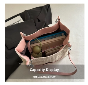 Top view of large straw tote bag showing spacious interior with daily essentials