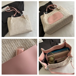 Detail view of woven tote bag with pink leather straps and spacious interior storage