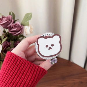 Detail view of Magsafe phone grip featuring a cute cartoon bear and Gift For You text