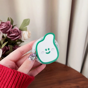 Close-up of cute pear-shaped acrylic phone grip with a smile design on wooden background