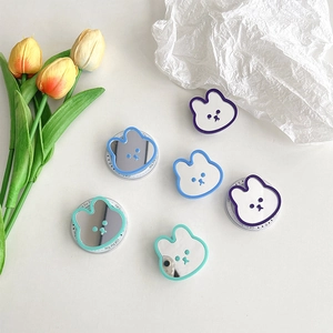 Detail of cute rabbit phone grips with mirrors in purple, blue and mint green colors