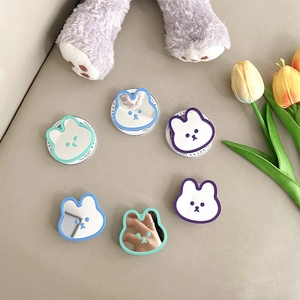 Cute rabbit-shaped mirror phone sockets in pastel colors with creative tulip background