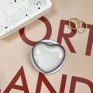 Magnetic heart-shaped phone grip in gradient grey resin with a glossy finish