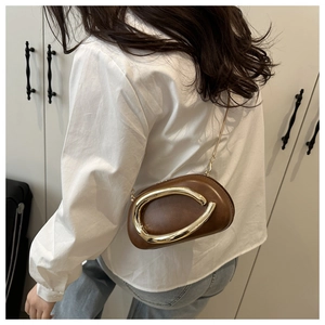 Brown vintage style mini crossbody bag with gold C-shape buckle and metal chain strap