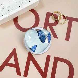 Solid heart-shaped magnetic phone grip with blue butterfly motif and resin finish