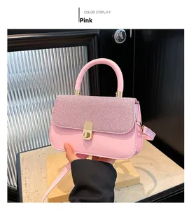 Detail of pink leather handbag featuring a sequined flap and metallic twist lock closure
