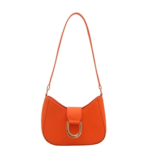 Minimalist orange dumpling hobo bag with a distinctive golden horseshoe metal buckle