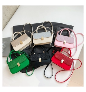 Selection of six colorful crossbody bags with glitter flip covers and metal buckles