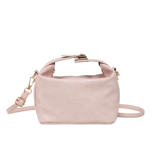 Pale pink patchwork leather crossbody bag with gold buckle and adjustable strap