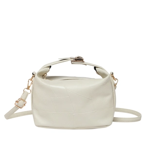 Elegant cream-colored dumpling bag with litchi grain texture and gold-tone hardware detail