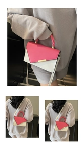 Détail du sac bicolore avec boucle dorée, poignée tissée et bandoulière rose fuchsia