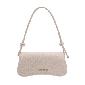 Pink faux crocodile leather shoulder bag with gold lettering and curved bottom