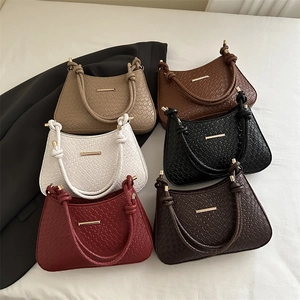 Minimalist woven baguette shoulder bags in multiple colors with elegant gold buckle
