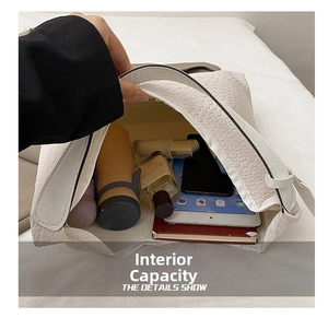 Internal capacity of large white crocodile pattern tote showing spacious inner storage