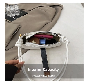 Interior view of white minimalist shoulder bag showing daily essentials storage capacity