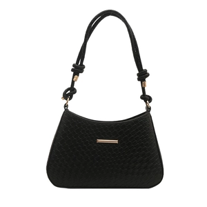 Chic black textured leather shoulder bag with gold hardware and knotted strap details