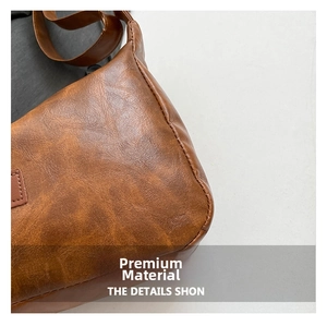 Close-up of vintage brown leather texture and premium stitching on the shoulder bag